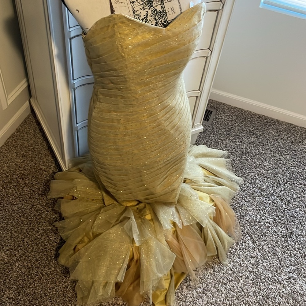 Gold strapless mermaid-style formal gown with a ruffled tulle skirting - Picture 9 of 11